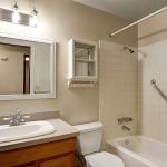 The master bedroom has its own private full bath with a south-facing obscure window for plenty of light throughout  the day, and a brand-new dual-flush toilet.  