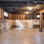 The full unfinished basement has great ceiling height and provides tons of dry storage space.  