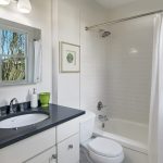 The Butler's Pantry connect to this sweet full bathroom also remodeled in 2017.   