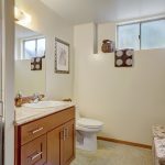 The lower 3/4 bath has a window for natural light and airflow.