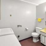The laundry room doubles up as a 3/4 bathroom, great for visiting guests. 