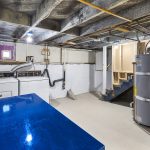 The basement hosts the laundry, updated electrical panel, gas furnace and water heater, and tons of work/studio/storage space.