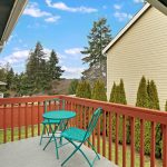 ...this sweet back deck perched with views of the fully-fenced yard below and territorial views beyond. The perfect spot for a barbeque, relaxing, and entertaining.  