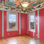The front bedroom bursts with color and character, from the ray gun collection up to...