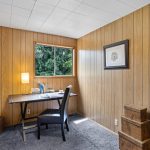 The fourth bedroom is a permitted and inspected addition from 1974. It can be used as a flex space for various purposes, such as an office, study, or storage. It has a large closet for extra storage and is located near the back deck. 