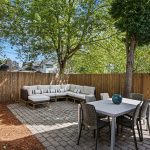 Step outside to your private retreat: a fenced outdoor patio, perfect for sipping your morning coffee, reading, or throwing a festive barbecue party.