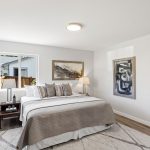 Neutral tones, updated lighting, and LVP flooring set a calm, modern tone.