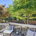 Sunny deck just off the dining room offers a seamless indoor-outdoor connection.