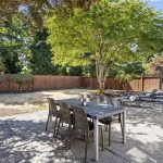 Spacious patio below provides plenty of room for alfresco dining or lounging.