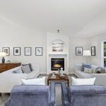 Seating area centers around the gas fireplace, creating a warm and inviting gathering space.