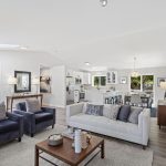 Vaulted ceilings and a skylight fill the living room with soft, natural light.