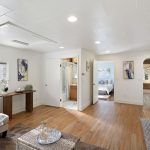 From the living area, an easy flow connects kitchen, bedroom, and bath—bright and practical, with room to breathe.