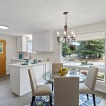 Bright and inviting, the dining area welcomes morning sun and frames the front yard through a wide east-facing window.