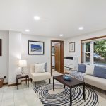 Tucked beneath the canopy, this space feels almost like a forest retreat. The large picture window connects you to the outside without sacrificing comfort inside.