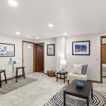 This entry nook adds charm and function, with room for a small dining table, storage shelves, and easy flow to the rest of the unit.