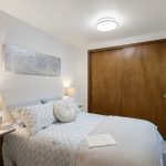 Just off the living room, this restful retreat enjoys gentle, consistent natural light and easy proximity to shared spaces.