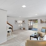 Sliding glass door offers direct access to the backyard and covered porch—perfect for indoor-outdoor flow. The door will need repair or replacement, offering an easy upgrade opportunity.