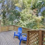 Two levels of deck space extend your living area into the trees—ideal for relaxing or entertaining in the forest-like surroundings. The lower deck leads directly to the basement’s laundry and utility zones.