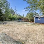 This large, terraced backyard is partially fenced, private, and full of potential—ideal for gardening, play, or entertaining.