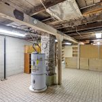 This expansive unfinished space includes a large workbench, pegboard wall, and built-in shelving—ideal for a home workshop, creative studio, or just everyday functionality. With around 1,000 sq ft total, there’s more than enough storage for two households.