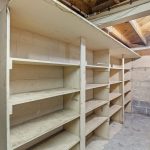 Wall-to-wall shelving and, just out of view, an extra-long workbench make this space ideal for tool organization, crafting, or project prep. Whether you're building, restoring, or simply storing—it’s ready to support what’s next.