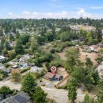 A central, tucked-in location with mature trees, privacy, and a surprisingly spacious lot—right in the heart of it all.