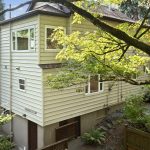 Tucked into the hillside, this home lives large with three full levels—while appearing as a modest one-story from the street. A private, tree-lined setting makes it feel like a hidden retreat.
