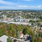 Urban Convenience Meets Forest Seclusion — Minutes from downtown and tucked beside the green expanse of Lewis Park, this North Beacon Hill home offers a rare blend of privacy and connectivity. Three levels, two living areas, and flexible spaces make it ideal for multigenerational living or future expansion.