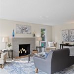 Step inside to a surprisingly spacious living room—calm tones, new carpet, and wide sightlines.