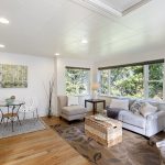 A canopy of green surrounds the room—frequent visits from eagles, hawks, and falcons only add to the treehouse feel.
