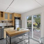 For a house this size, the kitchen does real work: substantial cabinetry and counter space, full-size appliances, and storage that doesn’t feel like an afterthought.