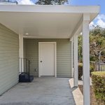 This is the everyday route home: park under cover, carry the groceries a few steps, and enter directly beside the kitchen.