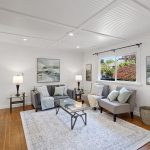 The front garden comes back into the room through the big window—leafy views and daylight pulled deep into the living space.