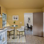 The kitchen’s dining area sits beside a south-facing window.