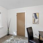 A small bonus room just off the kitchen includes a walk-in closet.