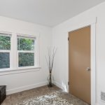 Two south-facing windows give the bonus room a leafy outlook over the backyard.