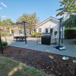 A barbecue is provided in the outdoor gathering area, making it easy to cook and gather outside.