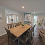 The dining table seats eight comfortably—useful for dinners, game nights, or gatherings that need more room than home.