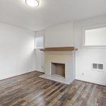 The decorative fireplace surround gives the room a strong period focal point.